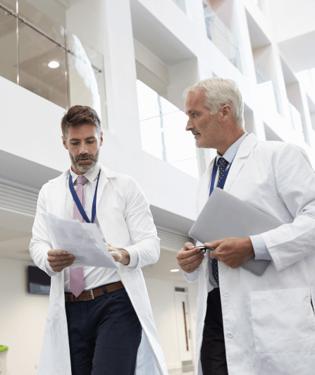 two guys in white lab coats